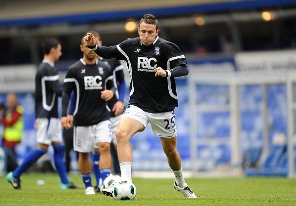 Jordan Mutch's Focused Warm-Up: Birmingham City FC Prepares for Birmingham City vs Mallorca (2010)