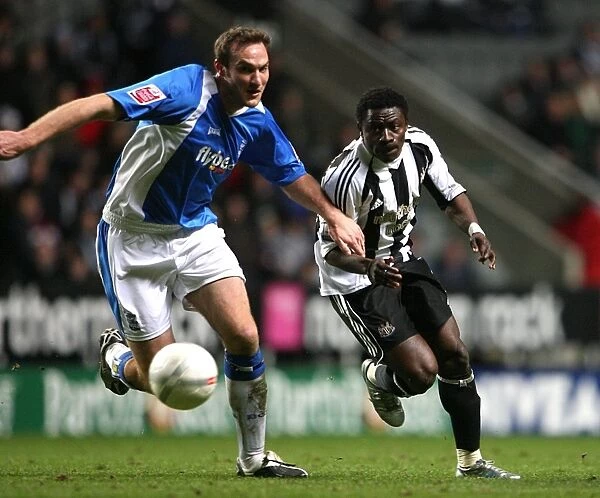 Martin vs. Martins: An Intense FA Cup Battle - Obafemi Martins of Newcastle United and Martin Taylor of Birmingham City Fight for Possession (January 17, 2007, St. James Park)