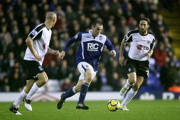 McFadden's Charge: Birmingham City's James McFadden Storms Forward Against Fulham's Konchesky and Greening (Barclays Premier League)