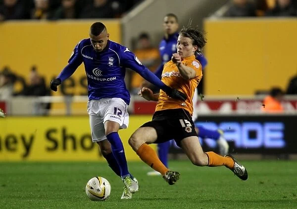 Morrison vs. Sigurdarson: Intense Tackle in Birmingham City vs. Wolverhampton Wanderers Championship Clash (2012)