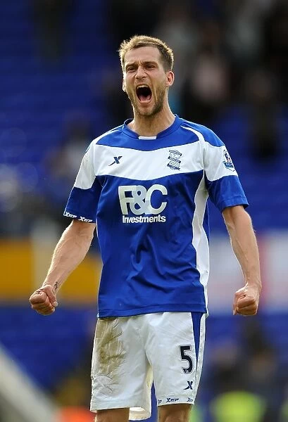 Roger Johnson's Euphoric Moment: Birmingham City FC's Victory Over Bolton Wanderers in the Barclays Premier League (02-04-2011)