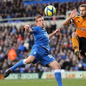 Airtight FA Cup Showdown: Rooney vs. Johnson's Heading Battle - Birmingham City vs. Wolverhampton Wanderers (January 7, 2012)