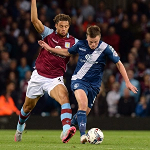 Battling for Control: Gestede vs. Gleeson in the Intense Capital One Cup Clash at Villa Park