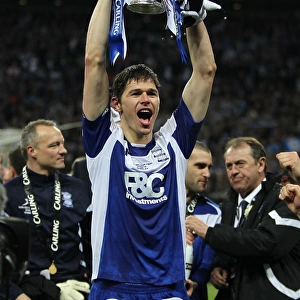 Birmingham Citys Nikola Zigic celebrates with the trophy