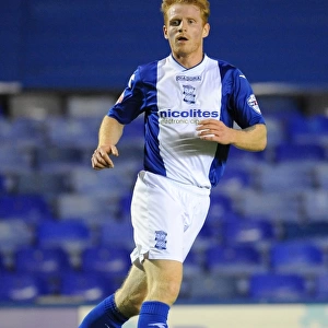Chris Burke vs Swansea City: Tense Moment in Birmingham City's Capital One Cup Clash at St. Andrew's (September 25, 2013)