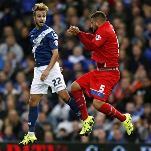 Intense Rivalry: Birmingham City vs. Gillingham - A Battle for the Ball in the Capital One Cup