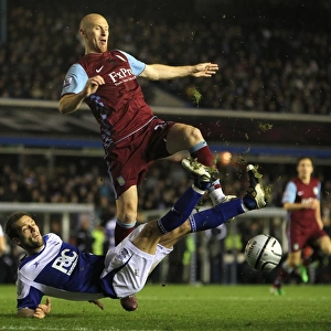 Intense Rivalry: Johnson vs. Collins Battle in Carling Cup Quarterfinals - Birmingham City vs. Aston Villa (02-12-2010)