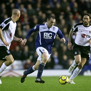 McFadden's Charge: Birmingham City's James McFadden Storms Forward Against Fulham's Konchesky and Greening (Barclays Premier League)