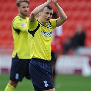 Paul Caddis of Birmingham City Honors Traveling Fans after Championship Match vs Doncaster Rovers