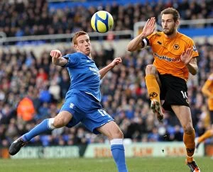 07-01-2012, FA Cup Round 3 v Wolverhampton Wanderers, St. Andrew's Collection: Airtight FA Cup Showdown: Rooney vs. Johnson's Heading Battle - Birmingham City vs