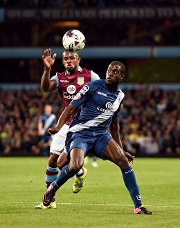Images Dated 22nd September 2015: Bacuna vs. Donaldson: A Football Rivalry Ignites in the Capital One Cup Clash between Aston Villa