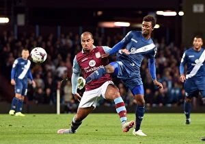 Images Dated 22nd September 2015: Battling for Control: Agbonlahor vs. Gray - Capital One Cup Rivalry at Villa Park