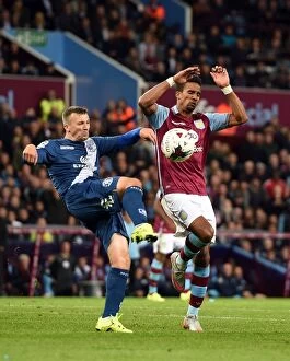 Images Dated 22nd September 2015: Battling for Control: Caddis vs. Sinclair in the Intense Capital One Cup Rivalry at Villa Park