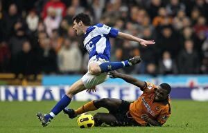 12-12-2010 v Wolverhampton Wanderers, Molineux Collection: Battling for Control: Ebanks-Blake vs. Dann in the Intense Barclays Premier League Rivalry