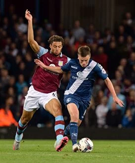 Images Dated 22nd September 2015: Battling for Control: Gestede vs. Gleeson in the Intense Capital One Cup Clash at Villa Park