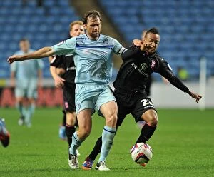 Images Dated 28th August 2012: Battling for Control: Redmond vs. Kilbane in the Intense Capital One Cup Clash between Coventry City