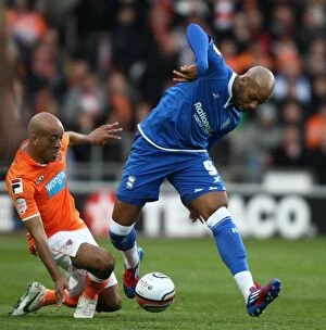 Images Dated 4th May 2012: Battling for the Playoff Lead: Marlon King vs. Alex Baptiste's Intense Clash in the Npower