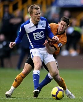 29-11-2009 v Wolverhampton Wanderers, Molineux Collection: Battling for Supremacy: Larsson vs. Jarvis - A Premier League Rivalry Erupts (November 2009)