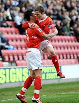 19-03-2011 v Wigan Athletic, DW Stadium Collection: Birmingham City: Ridgewell and Gardner Celebrate First Goal Against Wigan Athletic in Premier
