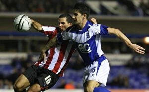 Images Dated 26th October 2010: Birmingham City vs. Brentford: A Tight Tussle in the Carling Cup - Wood vs. Ridgewell