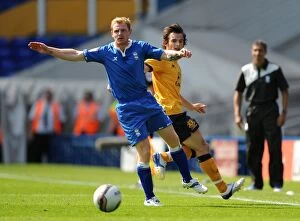 Images Dated 30th July 2011: Birmingham City vs Everton: Intense Battle for the Ball - Chris Burke vs Leighton Baines