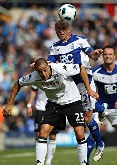 15-05-2011 v Fulham, St. Andrew's Collection: Birmingham City vs Fulham: Intense Aerial Battle Between Stephen Carr and Bobby Zamora