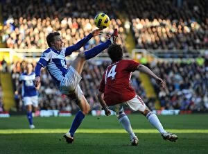 Images Dated 12th February 2011: Birmingham City vs Stoke City: Larsson vs Pugh Clash in the Barclays Premier League (12-02-2011)