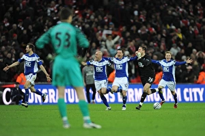 Birmingham City's Carling Cup Triumph: Szczesny's Disappointment Amidst Opponents Jubilant Goal Celebrations