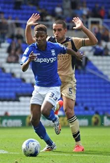 Images Dated 13th September 2014: Birmingham City's Demarai Gray Outsmarts Giuseppe Bellusci: A Crucial Battle in Birmingham City vs