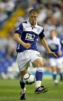 Images Dated 19th August 2009: Birmingham City's Gregory Vignal in Thrilling Action Against Portsmouth (2009)