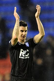 05-12-2009 v Wigan Athletic, DW Stadium Collection: Birmingham City's Liam Ridgewell: Celebrating Promotion to Premier League after Win against Wigan