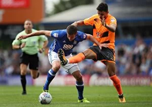 Images Dated 26th August 2017: Birmingham City's Lukas Jutkiewicz Evasively Dodges Tackle from Thiago Ilori (Sky Bet Championship)