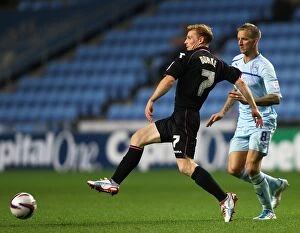 Images Dated 28th August 2012: Carl Baker vs. Chris Burke Clash: Birmingham City vs. Coventry City in Capital One Cup at Ricoh