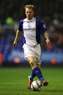 Images Dated 12th March 2014: Chris Burke vs Burnley: Intense Face-Off in Birmingham City's Sky Bet Championship Match at St