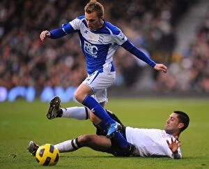 Images Dated 27th November 2010: Clash at Craven Cottage: A Premier League Battle - Dempsey vs. Larsson