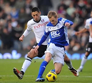 Images Dated 27th November 2010: Clash at Craven Cottage: A Premier League Showdown - Dempsey vs. Larsson