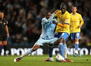 Images Dated 21st September 2011: Clash at Etihad: Abdul Razak vs. Guirane N'Daw - A Battle for Carling Cup Possession
