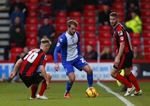Images Dated 14th December 2013: Clash of the Midfield: Shinnie vs Ritchie-Francis - Birmingham City vs AFC Bournemouth