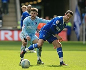 Images Dated 10th March 2012: Clash of Midlands Rivals: Norwood vs. Fahey - Coventry City vs