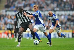 07-05-2011 v Newcastle United, St. James' Park Collection: Clash at St. James Park: Larsson vs Ameobi in Premier League Battle