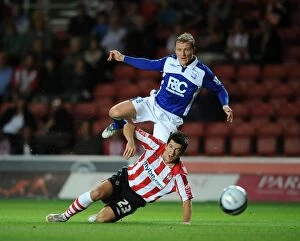Images Dated 25th August 2009: Clash at St. Mary's: Lloyd James vs. Gary McSheffrey, Carling Cup Second Round Showdown (2009)