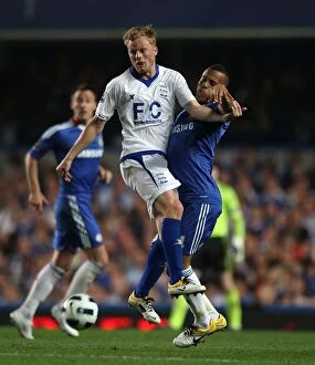 Images Dated 20th April 2011: Clash at Stamford Bridge: Bertrand vs. Larsson - Premier League Battle
