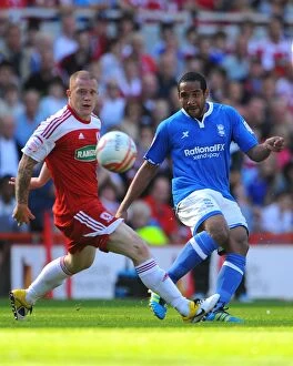 21-08-2011 v Middlesbrough, Riverside Stadium Collection: Clash of the Titans: Bailey vs. Beausejour in Championship Showdown (21-08-2011, Riverside Stadium)