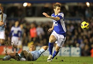 Images Dated 2nd February 2011: A Clash of Titans: Kompany vs. Bentley - Premier League Showdown at St. Andrew's