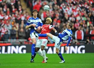 Clash at Wembley: Alex Song vs. Nikola Zigic and Lee Bowyer - A Battle in the Carling Cup Final Between Arsenal and Birmingham City