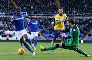 Sky Bet Championship - Birmingham City v Wigan Athletic - St. Andrew's Collection: Clayton Donaldson's Game-Changing Move: Outmaneuvering Scott Carson in Birmingham City's Victory