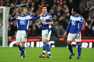 Deep in Thought: Bowyer, Ridgewell, and Beausejour's Intense Discussion during Birmingham City's Carling Cup Final against Arsenal at Wembley Stadium