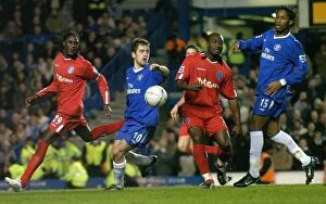 30-01-2005, Round 4 v Chelsea, Stamford Bridge Collection: Drogba vs Tebily and Melchiot: A FA Cup Battle at Stamford Bridge (January 30)