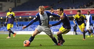 Images Dated 25th January 2014: FA Cup Fourth Round Showdown: Burke vs Britton's Intense Battle for Possession - Birmingham City