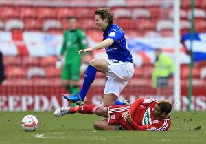 Images Dated 16th March 2013: Haroun's Early Tackle Injures Birmingham's Spector in Middlesbrough vs